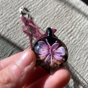 Beautiful Morano pendant on purple ribbon